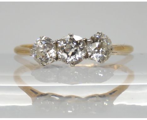 An 18ct gold three stone diamond ring, set with estimated approx 0.60cts of old cut diamonds, finger size K, weight 1.1gms Co