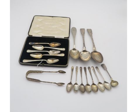 A collection of silver flatware including a pair of table spoons by William Bennett, London 1815, a pair of William IV silver