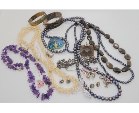 A Siam niello bangle, a silver bangle, two long strings of black pearls and other items Condition Report:Not available for th