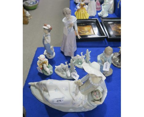 A large Nao figure of a reclining girl, other Nao's and Lladro's and a Royal Worcester figure Snowy Condition Report:Availabl