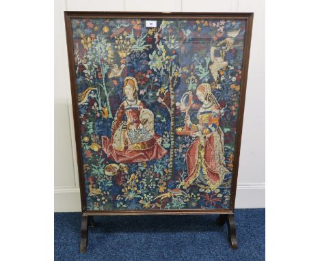 A 20th century tapestry fire screen, 97cm high x 68cm wide Condition Report:Available upon request