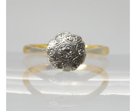 An 18ct gold vintage diamond flower ring, size K, weight 2.3gms Condition Report:Available upon request