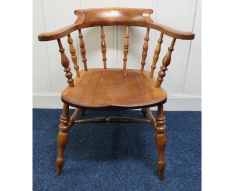 A 20th century spindle back captains chair, a 20th century beech spinning wheel and a wood bound travel trunk (3) Condition R