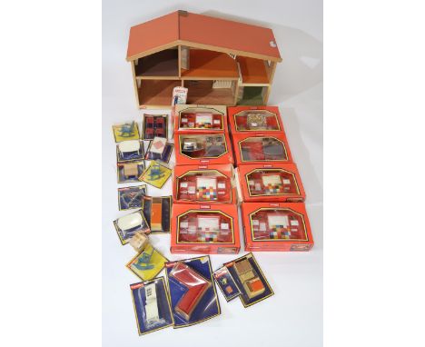 A vintage Lundby Dolls house complete with a quantity of boxed dolls house furniture including dining table sets, furniture &