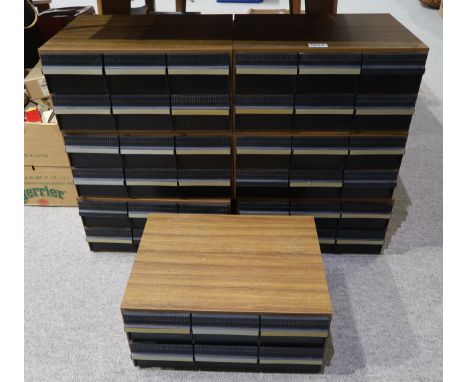 Seven vintage tape cassette storage cases, each with six drawers containing a quantity of primarily classical cassettes. Cond