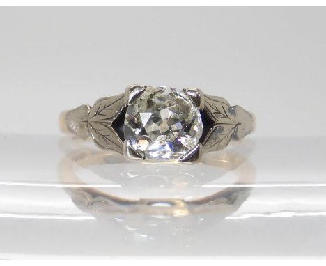 AN 18CT OLD CUT DIAMOND RING with white gold leaf design shoulders the approximate dimensions of the diamond are 6.19mm x 6.5