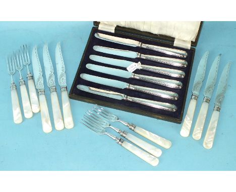 A set of six each mother of pearl handle fruit knives and forks, Sheffield 1913 and a set of six silver handled tea knives.