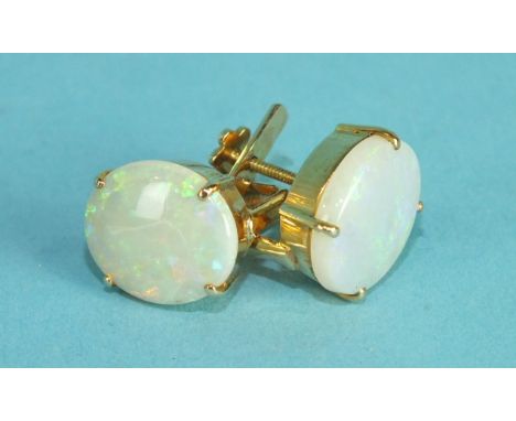 A pair of opal earrings, 13 x 11mm claw set in 18k gold screw fittings, 5.2g.