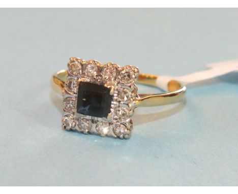 A sapphire and diamond square cluster ring, the dark blue sapphire claw set within a surround of ten 8/8 cut diamond on yello