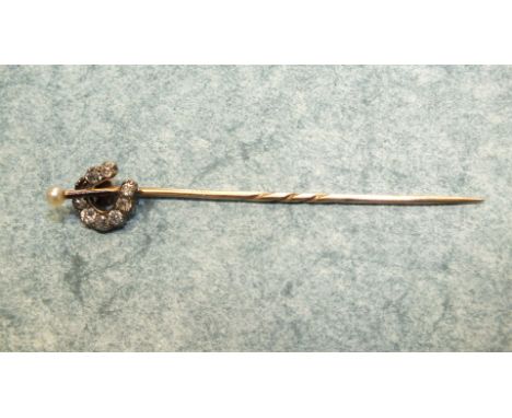 A Victorian diamond and pearl horseshoe stick pin, set eight old brilliant cut diamonds and single seed pearl, 1.7g.