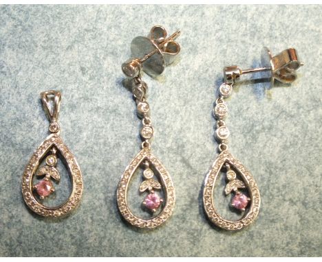 A pair of 18ct white gold and diamond earrings, each with diamond point and ruby flower suspended within a diamond point set 