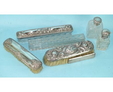 A collection of various dressing table items, comprising two silver topped scent bottles with stoppers, two silver backed bru