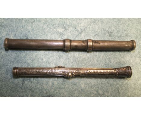 A Victorian Engine turned silver combination pen and pencil, 11.8 cm, and another, (af). (2)