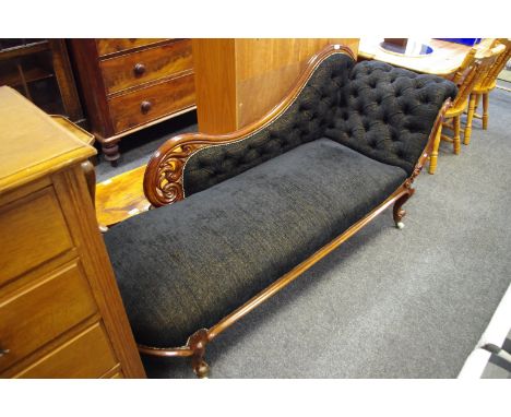 A Victorian mahogany chaise, button upholstery, ceramic casters. 