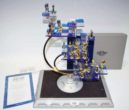 A Franklin Mint Official Star Trek Tridimensional Chess Set, including three large playing boards, four smaller 'movable atta