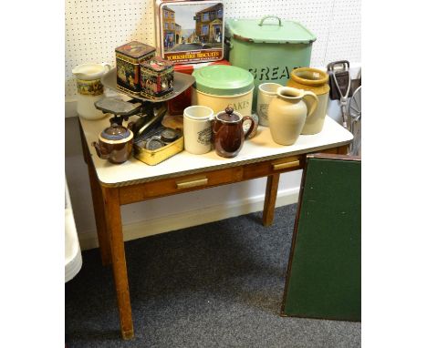 A Retro Mid 20th century kitchen table holding two drawers to frieze; enamel bread bin; vintage tins; Kitchenalia;etc 