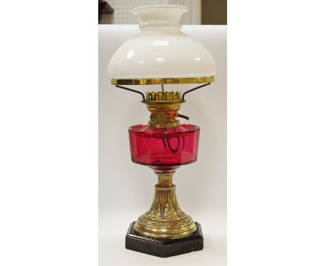Victorian oil lamp, opaque shade, cranberry reservoir, brass base, converted to electric