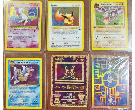 Pokemon cards - a 1990's pre-release holofoil shiny Dark Gyarados 8/82, apre-release Aerodactyl 1/61; a promotional Eevee hol