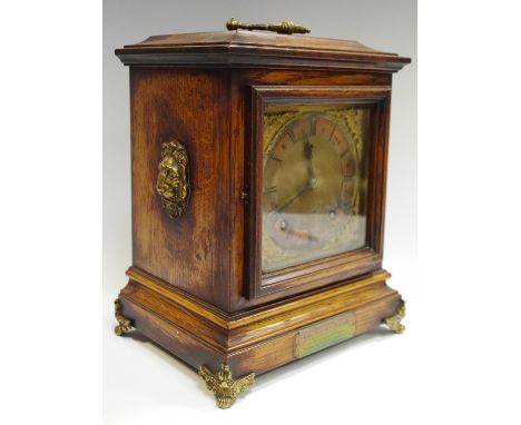 A late Victorian oak mantel clock, with military interest plaque