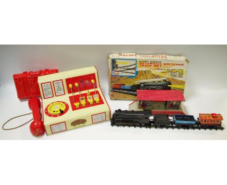 A Marx (British) automatic Switcher train set, comprising 060 locomotive with light and tender, caboose, open car, track, ori