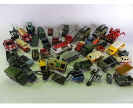A box containing an assortment of vintage die cast model vehicles to include numerous examples by Dinky, the Dinky Armoured C