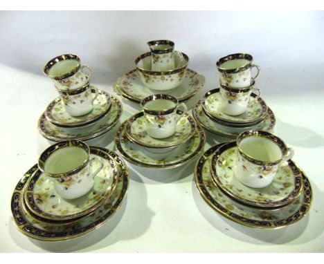 An incomplete Edwardian tea set "The Elite" with printed and infilled floral detail comprising seven cups, twelve saucers, th