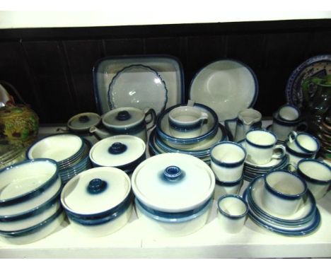 An extensive collection of Wedgwood Blue Pacific pattern dinner and tea wares including three covered tureens, rectangular se