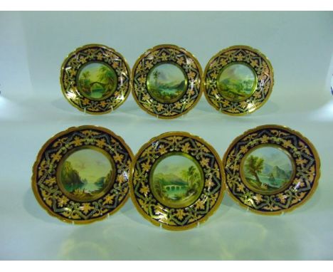 A set of six good quality 19th century dessert plates each with a differing central circular panel showing a landscape subjec