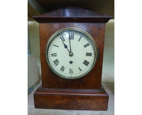 A late 19th century walnut bracket clock with eight day timepiece set beneath an architectural pediment