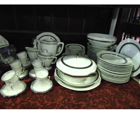 A collection of continental coffee wares with silver coloured border decoration comprising coffee pot, milk jug, covered suga