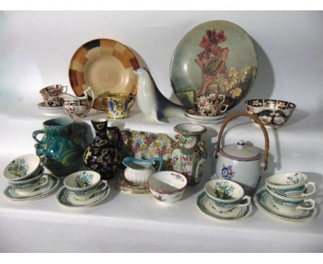 A collection of ceramics including a Goebel model of a seal, a Poole Pottery biscuit barrel and cover, a collection of 19th c