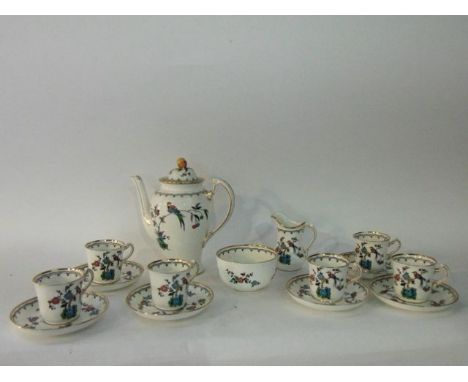 A Tuscan China six place tea service with printed and enamelled style bird decoration comprising coffee pot, milk jug, sugar 