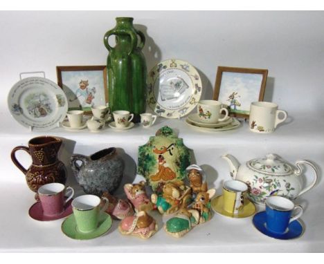 A boxed harlequin set of four Royal Worcester coffee cups and matching saucers with various coloured glazed finishes celebrat