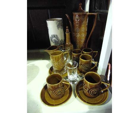 A Portmeirion Totem pattern six place coffee set in the amber colourway including coffee pot, milk jug, sugar bowl, six cups,