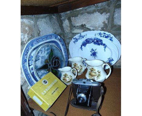 A 19th century blue and white Willow pattern meat plate, two further graduated blue and white printed plates, a set of three 