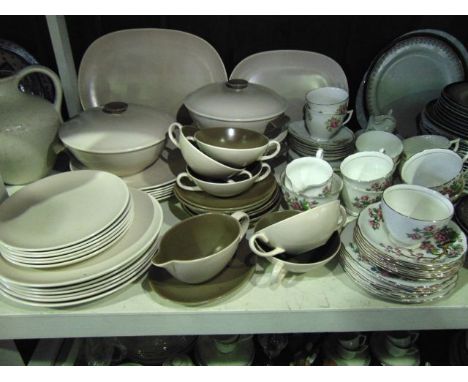 A collection of Poole Pottery dinner wares with mushroom and cream glazed finish comprising two oval serving dishes, three tu