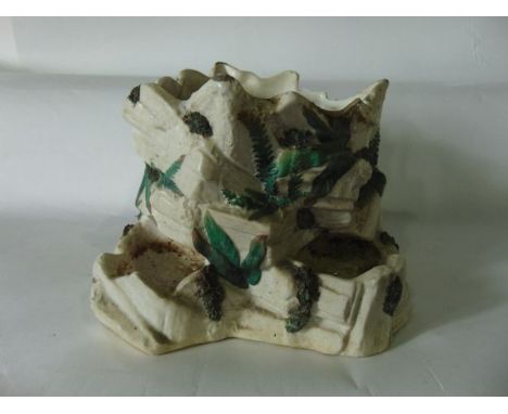An unusual 19th century Worcester jardinière modelled as a rustic tree trunk with white glazed finish and green painted simul