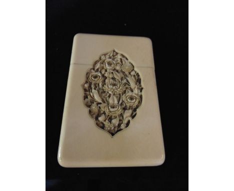 A 19th century Cantonese ivory card case with handworked floral panel to front and rear elevations