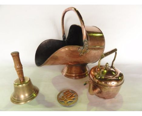 A copper coal helmet with looping handle, a Victorian copper kettle, a brass school yard bell with turned timber handle, a pi