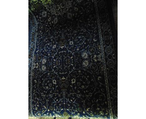 A Persian style wool runner, the bright blue field with abstract floral detail within running borders