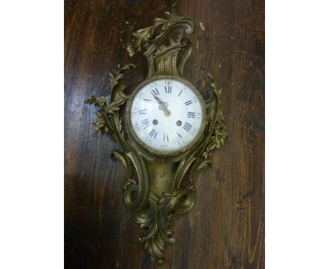 A 19th century Cartel clock in a brass case with convex enamel dial and eight day striking movement