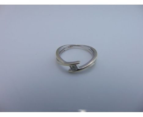 A diamond overlap ring, centred with four princess-cut diamonds, in 9ct white gold, size M