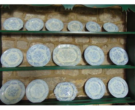 An extensive collection of 19th century Asiatic pattern blue and white printed dinner wares including five tureens and covers