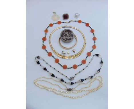 An Art Deco style black and white bead necklace; three bangles; a tri-gold coloured metal fringe necklace; a "Studs & Links" 