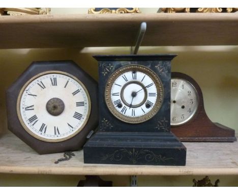 A Victorian cast iron mantle clock, a Napoleon top hat mantle clock in an oak case and a postmans alarm clock in an octagonal