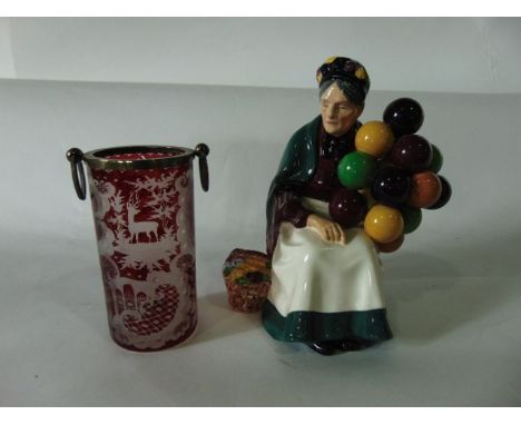 A Royal Doulton figure - The Balloon Seller HN13156 together with a 19th century continental cylindrical vase with ruby colou