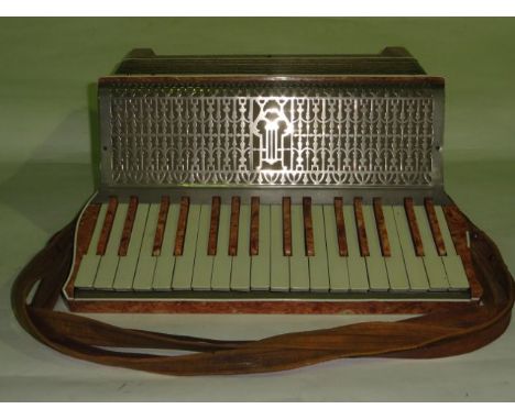 A vintage Casale Verona piano accordion with mottled pink casing,  white buttons and gold bellows, etc, 19 cm tall x 43 cm wi