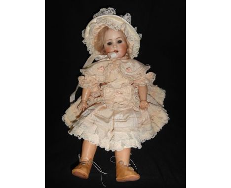 An antique German bisque headed doll by Max Handwerck 1900, marked to head reverse Bebe Elite 286 0 1/8, the head with well p