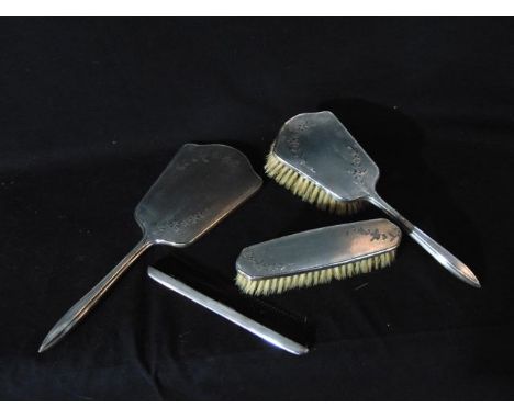 A silver dressing set, W. G. Sothers Ltd, Birmingham, 1957 & 1961, comprising: a hand mirror, a hair brush, a clothes brush a