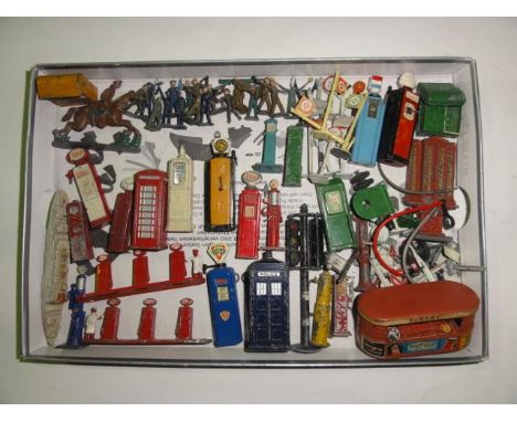 A quantity of vinatage painted lead and other model street furniture to include ESSO and Castrol fuel pumps, traffic lights, 